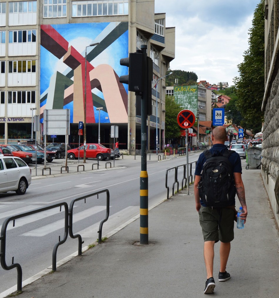 Danijel in front of his mural, Serbia